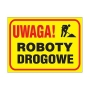 żółty znak drogowy z grafiką i napisem UWAGA ROBOTY DROGOWE