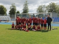 zdjęcie grupowe drużyny z Litwy na stadionie na tle bramki