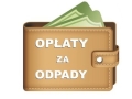 grafika skórzanego portfela,z krórego wystaja dwa banknoty oraz biały napis: OPŁATY za ODPADY