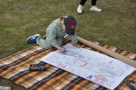  stanowiska z atrakcjami dla dzieci:  kolorowanie plakatu o Hajnówce, 